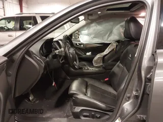 2014 Infiniti Q50 Premium with VIN JN1BV7ARXEM699902, listed as a IAAI auction lot 42135410 with 103,929 mi miles and . Bid and sale history available at DreamBid. Image 5.
