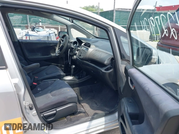 2011 Honda Fit Sport with VIN JHMGE8H51BS005356, listed as a IAAI auction lot 42279124 with 285,524 mi miles and . Bid and sale history available at DreamBid. Image 5.