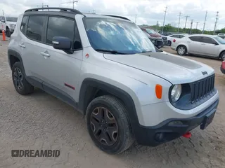 2017 Jeep Renegade Trailhawk z VIN ZACCJBCB6HPE63267, wystawiony jako IAAI lot #42027156 z przebiegiem 64 899 mil mil oraz . Historia ofert i sprzedaży dostępna na DreamBid. Obrazek 1.