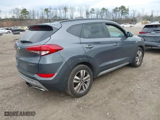 2017 Hyundai Tucson Value with VIN KM8J33A21HU359113, listed as a IAAI auction lot 41897638 with 80,010 mi miles. Bid and sale history available at carsss.com. Image 4.