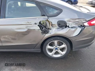 2013 Ford Fusion SE Hybrid with VIN 3FA6P0LU4DR267643, listed as a IAAI auction lot 41846681 with 148,002 mi miles. Bid and sale history available at carsss.com. Image 6.