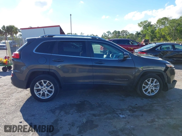 2016 Jeep Cherokee Altitude with VIN 1C4PJLCSXGW363598, listed as a IAAI auction lot 41670125 with 135,603 mi miles. Bid and sale history available at carsss.com. Image 13.
