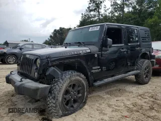 2015 Jeep Wrangler Unlimited Freedom with VIN 1C4BJWDG1FL745377, listed as a Copart auction lot 62645755 with 128,740 mi miles and Salvage title. Bid and sale history available at DreamBid. Image 1.