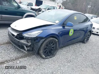 2021 Tesla Model Y Standard Range with VIN 5YJYGDED8MF122985, listed as a IAAI auction lot 41430423 with 120,302 mi miles and . Bid and sale history available at carsss.com. Image 18.