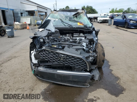 2023 Toyota Corolla Cross XLE with VIN 7MUDAABG4PV070998, listed as a Copart auction lot 56869585 with Not provided miles and Non repairable. Bid and sale history available at DreamBid. Image 5.