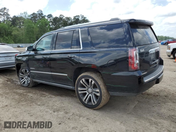 2019 GMC Yukon Denali with VIN 1GKS1CKJ0KR259491, listed as a Copart auction lot 51071335 with 105,294 mi miles and Salvage Title. Bid and sale history available at carsss.com. Image 2.