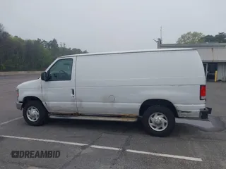 2012 Ford Econoline Cargo Recreational with VIN 1FTNE2EW8CDA64042, listed as a IAAI auction lot 42197470 with 130,647 mi miles. Bid and sale history available at carsss.com. Image 14.