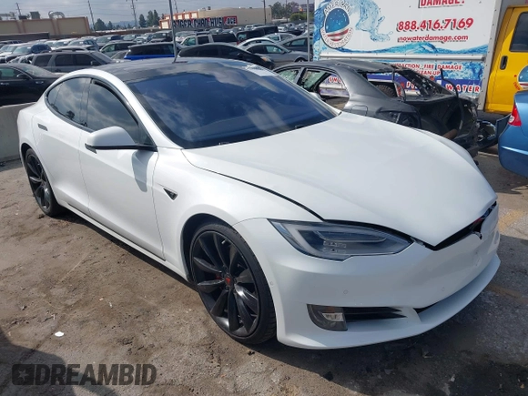 2016 Tesla Model S 90D with VIN 5YJSA1E27GF153525, listed as a IAAI auction lot 41539221 with 145,771 mi miles and . Bid and sale history available at DreamBid. Image 1.