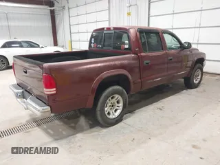 2001 Dodge Dakota Sport with VIN 1B7GG2AN71S209614, listed as a IAAI auction lot 42066349 with 242,675 mi miles. Bid and sale history available at carsss.com. Image 4.