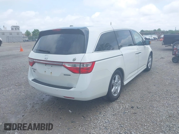 2013 Honda Odyssey Touring with VIN 5FNRL5H9XDB049390, listed as a IAAI auction lot 42532861 with 129,376 mi miles and . Bid and sale history available at DreamBid. Image 4.