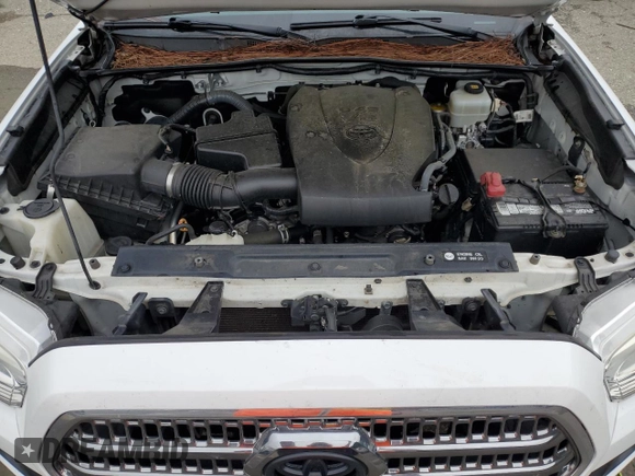 2017 Toyota Tacoma SR5 z VIN 5TFCZ5AN1HX113842, wystawiony jako Copart lot #60711285 z przebiegiem 124 799 mil mil oraz Szkoda całkowita • Salvage title. Historia ofert i sprzedaży dostępna na DreamBid. Obrazek 11.