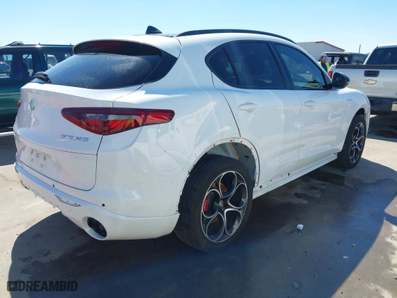 2023 Alfa Romeo Stelvio Ti with VIN ZASPAKBN4P7D63524, listed as a IAAI auction lot 41626631 with 37,731 mi miles. Bid and sale history available at carsss.com. Image 4.