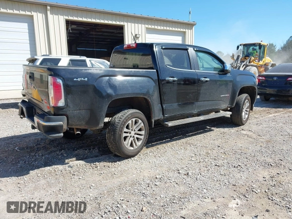2015 GMC Canyon 2WD SLT with VIN 1GTG5CE35F1249224, listed as a IAAI auction lot 41697796 with 180,230 mi miles. Bid and sale history available at carsss.com. Image 4.