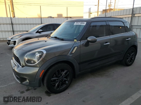 2014 MINI Countryman S with VIN WMWZC3C59EWP29137, listed as a Copart auction lot 79721804 with 124,871 mi miles and Salvage title. Bid and sale history available at DreamBid. Image 1.