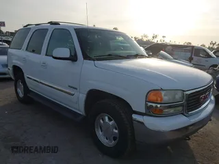 2001 GMC Yukon SLT with VIN 1GKEK13T41R171024, listed as a IAAI auction lot 41582633 with 216,077 mi miles. Bid and sale history available at carsss.com. Image 1.