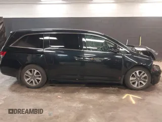 2014 Honda Odyssey Touring with VIN 5FNRL5H94EB105745, listed as a IAAI auction lot 41744012 with 77,032 mi miles and . Bid and sale history available at DreamBid. Image 13.