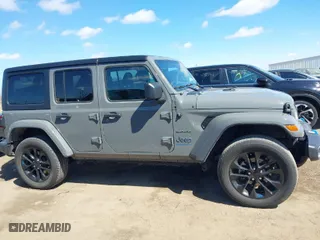 2023 Jeep Wrangler 4xe Sahara with VIN 1C4JJXP62PW696002, listed as a IAAI auction lot 41891127 with 44,567 mi miles. Bid and sale history available at carsss.com. Image 13.