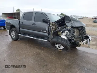 2014 Toyota Tacoma with VIN 3TMLU4EN1EM144061, listed as a IAAI auction lot 41183063 with 187,514 mi miles and . Bid and sale history available at DreamBid. Image 1.