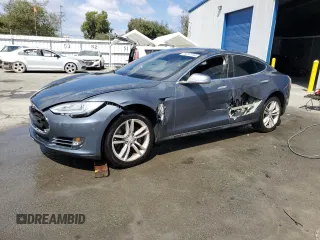 2013 Tesla Model S with VIN 5YJSA1CG9DFP09733, listed as a Copart auction lot 71574474 with 88,163 mi miles and Salvage title. Bid and sale history available at DreamBid. Image 1.
