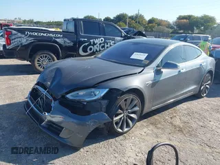 2014 Tesla Model S 60 with VIN 5YJSA1H1XEFP31911, listed as a IAAI auction lot 42029215 with Not Provided miles and . Bid and sale history available at DreamBid. Image 17.