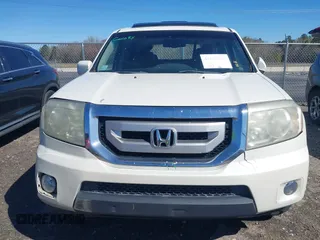 2011 Honda Pilot Touring with VIN 5FNYF4H97BB067954, listed as a IAAI auction lot 41832617 with 141,141 mi miles. Bid and sale history available at carsss.com. Image 12.