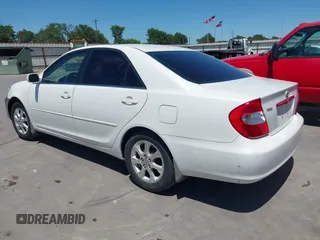 2004 Toyota Camry LE with VIN JTDBE32K840277463, listed as a IAAI auction lot 42080523 with 139,558 mi miles. Bid and sale history available at carsss.com. Image 3.