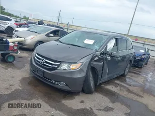 2016 Honda Odyssey Touring Elite with VIN 5FNRL5H97GB010048, listed as a IAAI auction lot 40212711 with 119,009 mi miles and . Bid and sale history available at DreamBid. Image 2.