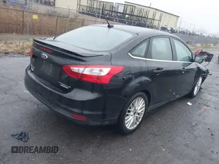 2014 Ford Focus Titanium with VIN 1FADP3J24EL439065, listed as a IAAI auction lot 40868973 with 167,739 mi miles. Bid and sale history available at carsss.com. Image 4.