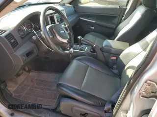 2009 Jeep Grand Cherokee Laredo with VIN 1J8HR48P39C559192, listed as a Copart auction lot 74007094 with 105,997 mi miles and Salvage Title. Bid and sale history available at carsss.com. Image 7.