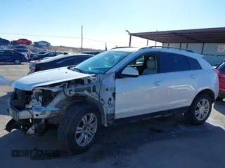2015 Cadillac SRX with VIN 3GYFNAE34FS557297, listed as a IAAI auction lot 41388573 with 124,185 mi miles and . Bid and sale history available at DreamBid. Image 14.