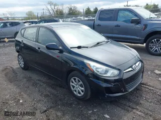 2014 Hyundai Accent GS with VIN KMHCT5AE3EU193249, listed as a IAAI auction lot 41973614 with 136,655 mi miles. Bid and sale history available at carsss.com. Image 1.