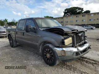 2002 Ford F-250 XL with VIN 1FTNW20F12EB93947, listed as a Copart auction lot 77836054 with 322,030 mi miles and Salvage Title. Bid and sale history available at DreamBid. Image 4.
