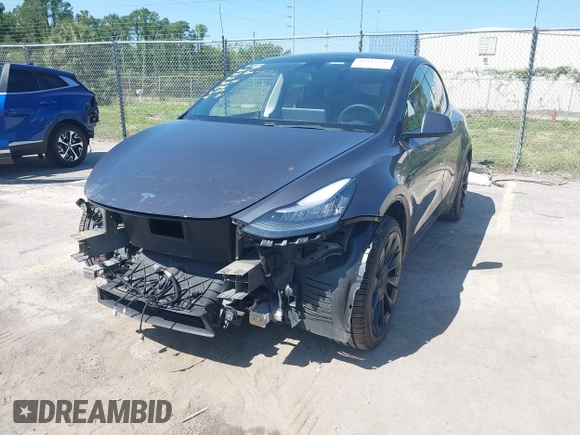 2021 Tesla Model Y Long Range with VIN 5YJYGDEE4MF076791, listed as a IAAI auction lot 41945750 with Not Provided miles and . Bid and sale history available at DreamBid. Image 2.