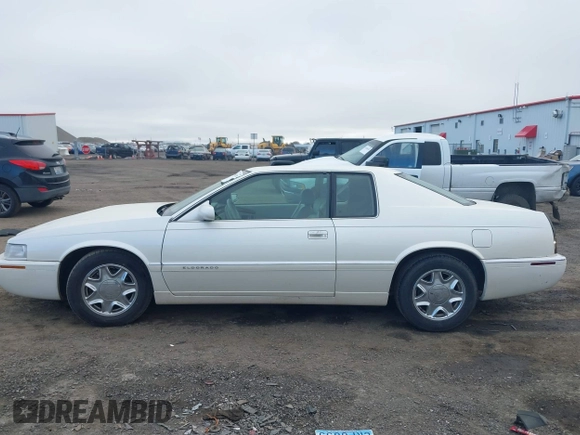 1998 Cadillac Eldorado z VIN 1G6EL12Y2WU603722, wystawiony jako IAAI lot #41879733 z przebiegiem 81 780 mil mil oraz . Historia ofert i sprzedaży dostępna na DreamBid. Obrazek 14.