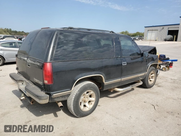 1999 Chevrolet Tahoe z VIN 3GNEC18R3XG165012, wystawiony jako Copart lot #75803204 z przebiegiem 227 608 mil mil oraz Szkoda całkowita • Salvage title. Historia ofert i sprzedaży dostępna na DreamBid. Obrazek 3.
