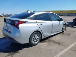 2021 Toyota Prius L Eco with VIN JTDKAMFUXM3144991, listed as a IAAI auction lot 42147025 with 106,466 mi miles and . Bid and sale history available at DreamBid. Image 4.