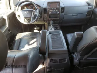 2014 Nissan Titan Pro-4X with VIN 1N6AA0EC2EN519983, listed as a Copart auction lot 71496934 with 150,259 mi miles and Salvage title. Bid and sale history available at DreamBid. Image 8.