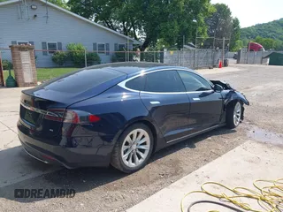 2014 Tesla Model S 60 with VIN 5YJSA1H17EFP65983, listed as a IAAI auction lot 42399288 with 166,365 mi miles and . Bid and sale history available at DreamBid. Image 4.