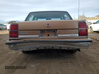 1989 Oldsmobile Delta z VIN 1G3HN54C2KW373577, wystawiony jako Copart lot #41532245 z przebiegiem 78 364 mil mil oraz Tytuł czysty. Historia ofert i sprzedaży dostępna na DreamBid. Obrazek 6.