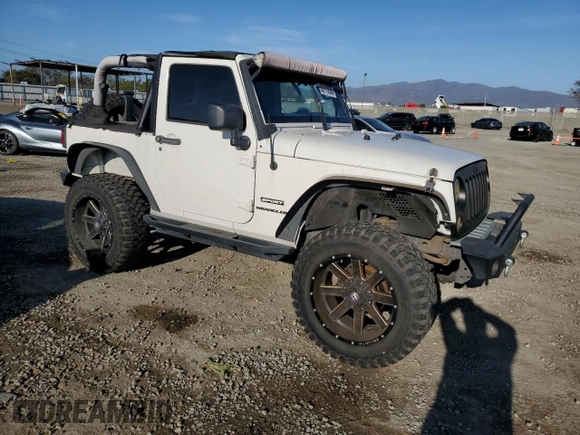 2010 Jeep Wrangler Sport with VIN 1J4AA2D16AL144842, listed as a Copart auction lot 50173535 with 106,000 mi miles and Salvage Title. Bid and sale history available at carsss.com. Image 4.