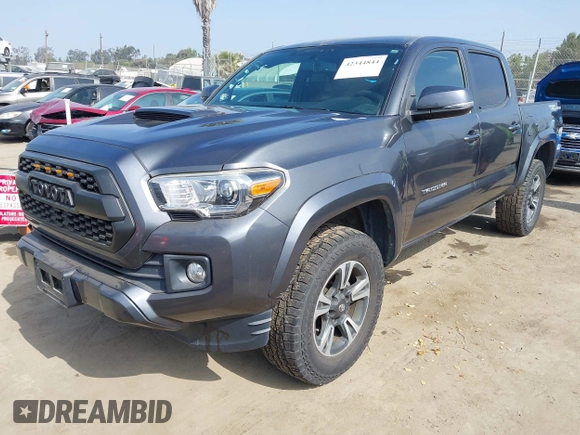 2017 Toyota Tacoma SR5 z VIN 3TMAZ5CN2HM047103, wystawiony jako IAAI lot #42344844 z przebiegiem 88 090 mil mil oraz . Historia ofert i sprzedaży dostępna na DreamBid. Obrazek 2.