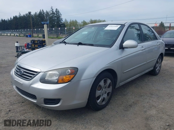 2009 Kia Spectra EX with VIN KNAFE221595659217, listed as a IAAI auction lot 42014406 with 140,527 mi miles. Bid and sale history available at carsss.com. Image 2.
