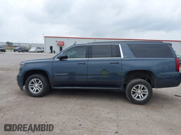 2020 Chevrolet Suburban LT z VIN 1GNSKHKC2LR259315, wystawiony jako IAAI lot #42129791 z przebiegiem 72 979 mil mil oraz . Historia ofert i sprzedaży dostępna na DreamBid. Obrazek 14.