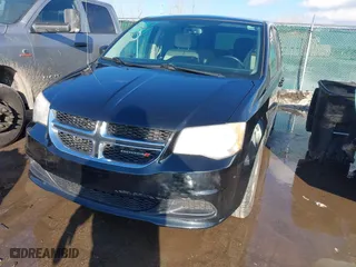 2014 Dodge Grand Caravan SXT with VIN 2C4RDGBG7ER197065, listed as a IAAI auction lot 41674441 with 233,065 mi miles. Bid and sale history available at carsss.com. Image 6.