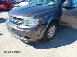 2015 Dodge Journey SE z VIN 3C4PDCAB5FT739266, wystawiony jako IAAI lot #41725086 z przebiegiem 134 109 mil mil oraz . Historia ofert i sprzedaży dostępna na DreamBid. Obrazek 6.