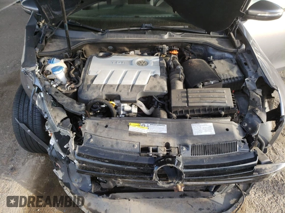 2014 Volkswagen Golf TDI w/Sunroof & Nav z VIN WVWDM7AJ9EW000668, wystawiony jako Copart lot #48564565 z przebiegiem 28 578 mil mil oraz Szkoda całkowita • Salvage title. Historia ofert i sprzedaży dostępna na DreamBid. Obrazek 13.