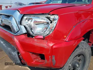 2014 Toyota Tacoma with VIN 5TFUU4EN7EX084785, listed as a IAAI auction lot 41879329 with 133,216 mi miles and . Bid and sale history available at DreamBid. Image 6.