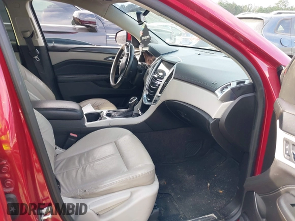 2015 Cadillac SRX z VIN 3GYFNAE3XFS572970, wystawiony jako IAAI lot #40854902 z przebiegiem 124 779 mil mil oraz . Historia ofert i sprzedaży dostępna na DreamBid. Obrazek 5.