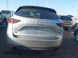 2020 Mazda CX-5 Touring with VIN JM3KFACM5L0766698, listed as a IAAI auction lot 42006157 with 80,288 mi miles and . Bid and sale history available at carsss.com. Image 16.