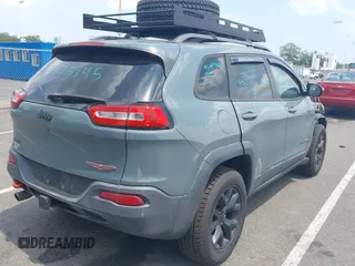 2015 Jeep Cherokee Trailhawk with VIN 1C4PJMBB0FW528421, listed as a IAAI auction lot 42591132 with 166,425 mi miles and . Bid and sale history available at DreamBid. Image 4.